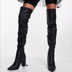 Leather look thigh high heeled boots in black